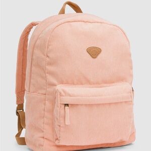 Billabong Schools Out Corduroy Backpack in a peach or sunstone color.